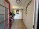 Inviting foyer with tile flooring, decorative plants, and a frosted glass front door at 6117 Cromwell Cir, Las Vegas, NV 89107