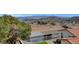 Aerial view of a house with an enclosed backyard, and the desert landscape visible in the background at 621 Mount Elbert Way, Boulder City, NV 89005