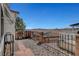 Fenced backyard with decorative iron fencing, brick accents, and mountain views in the distance at 621 Mount Elbert Way, Boulder City, NV 89005