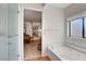 Bright bathroom with a jetted tub, with a view into the main bedroom at 621 Mount Elbert Way, Boulder City, NV 89005