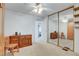 This spacious bedroom includes a ceiling fan and a large closet with mirrored doors and shelving at 621 Mount Elbert Way, Boulder City, NV 89005