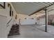 Covered carport area with direct access to the home via steps and a door to the living space at 621 Mount Elbert Way, Boulder City, NV 89005