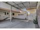 Spacious covered carport, offering convenient access to the home and featuring a garage door at 621 Mount Elbert Way, Boulder City, NV 89005