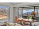 Dining room with scenic views, a cozy table setting, and lots of natural light at 621 Mount Elbert Way, Boulder City, NV 89005