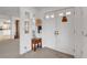 Bright entryway featuring a double door, accent table, and view into the kitchen at 621 Mount Elbert Way, Boulder City, NV 89005