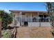 Exterior of home with covered porch, desert landscaping and rock features at 621 Mount Elbert Way, Boulder City, NV 89005