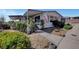 Charming single-story home featuring a covered entrance, landscaped yard, and an American flag at 621 Mount Elbert Way, Boulder City, NV 89005