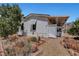 Exterior of home with desert landscaping, rock accents, and a covered area at 621 Mount Elbert Way, Boulder City, NV 89005