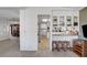 Bright kitchen featuring bar seating and views into the living room and additional kitchen space at 621 Mount Elbert Way, Boulder City, NV 89005