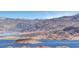 Picturesque lake view featuring rugged mountains, a pristine shoreline, and clear blue waters at 621 Mount Elbert Way, Boulder City, NV 89005