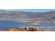 Scenic view of a beautiful lake surrounded by desert landscape and an isolated building at 621 Mount Elbert Way, Boulder City, NV 89005