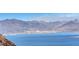 Stunning lake view of tranquil blue waters, and rugged mountains under a clear sky at 621 Mount Elbert Way, Boulder City, NV 89005