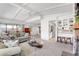 Open-concept living room with fireplace, bar seating, and views of the dining and kitchen areas at 621 Mount Elbert Way, Boulder City, NV 89005
