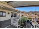 Wide, sheltered porch offering views of mountains, seating, and BBQ area for entertaining at 621 Mount Elbert Way, Boulder City, NV 89005