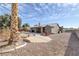 Spacious backyard with a covered patio and mature landscaping, providing a private outdoor retreat at 6308 Canyon Ridge Dr, Las Vegas, NV 89108