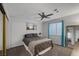This cozy bedroom features a ceiling fan and a large window for plenty of natural light at 6308 Canyon Ridge Dr, Las Vegas, NV 89108