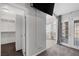 This bedroom features French doors, TV, and an ensuite bathroom with a glass block window at 6308 Canyon Ridge Dr, Las Vegas, NV 89108