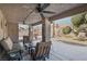 Inviting covered patio with ceiling fans and comfortable seating area, perfect for outdoor relaxation at 6308 Canyon Ridge Dr, Las Vegas, NV 89108