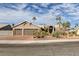 Charming single-story home with desert landscaping, a three-car garage, and beautiful curb appeal at 6308 Canyon Ridge Dr, Las Vegas, NV 89108