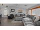 Living room features vaulted ceiling, large sectional sofa, and an entertainment center at 6308 Canyon Ridge Dr, Las Vegas, NV 89108