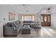 Bright living room showcasing vaulted ceilings, a large sectional sofa, and views to the entryway at 6308 Canyon Ridge Dr, Las Vegas, NV 89108