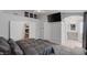 Bright, airy main bedroom featuring an en suite bathroom, TV, and closet at 6308 Canyon Ridge Dr, Las Vegas, NV 89108