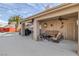 Covered outdoor patio with comfortable seating, ceiling fan, and easy access to the backyard and pool at 6308 Canyon Ridge Dr, Las Vegas, NV 89108