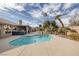 Lush backyard pool with desert landscaping, providing a private oasis for relaxation and recreation at 6308 Canyon Ridge Dr, Las Vegas, NV 89108