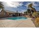 Inviting backyard pool surrounded by desert landscaping, perfect for outdoor entertaining and relaxation at 6308 Canyon Ridge Dr, Las Vegas, NV 89108