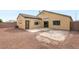 This property has a gravel backyard with a concrete patio and access doors and windows at 6512 N Bruce St, North Las Vegas, NV 89086