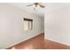 Bright bedroom with wood floors, ceiling fan, and natural light from the window at 6512 N Bruce St, North Las Vegas, NV 89086
