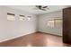 Bedroom with wood floors, a ceiling fan, and plenty of natural light at 6512 N Bruce St, North Las Vegas, NV 89086