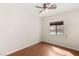 Bedroom with wood floors, ceiling fan and natural light from the window at 6512 N Bruce St, North Las Vegas, NV 89086