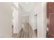 Inviting entryway with hardwood floors, leading to open floor plan and rooms with natural light at 6512 N Bruce St, North Las Vegas, NV 89086