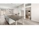 Spacious open kitchen featuring a large island, stainless appliances, and wood-look floors at 6512 N Bruce St, North Las Vegas, NV 89086