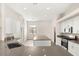 Bright kitchen features white cabinets, stainless steel appliances, and a large gray quartz island at 6512 N Bruce St, North Las Vegas, NV 89086