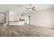 Bright and open living room features hardwood floors and a kitchen with quartz island at 6512 N Bruce St, North Las Vegas, NV 89086