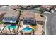 Aerial view of backyard with large pool, palm trees, patio, and a play structure at 6638 Dazzling Heights Ln, Las Vegas, NV 89110