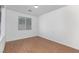 Modern bedroom with hardwood floors, and a large window providing natural light at 6638 Dazzling Heights Ln, Las Vegas, NV 89110