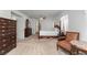 Bedroom featuring a four-poster bed, dresser and a comfortable seating area at 6638 Dazzling Heights Ln, Las Vegas, NV 89110