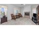 Bright bedroom features a fireplace, windows, and comfortable seating area at 6638 Dazzling Heights Ln, Las Vegas, NV 89110