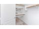 Walk-in closet with built-in shelving and door, ready for organizing at 6638 Dazzling Heights Ln, Las Vegas, NV 89110