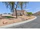 Single Gathering home with desert landscaping, and a mountain view in the background at 6638 Dazzling Heights Ln, Las Vegas, NV 89110
