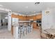 Bright eat-in kitchen with island, granite counters, breakfast bar, and stainless steel appliances at 6638 Dazzling Heights Ln, Las Vegas, NV 89110