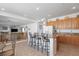 Spacious kitchen with center island, granite counters, breakfast bar, and access to the living room at 6638 Dazzling Heights Ln, Las Vegas, NV 89110