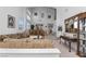 Bright living room with two-story ceiling, lots of natural light and a cozy seating area at 6638 Dazzling Heights Ln, Las Vegas, NV 89110