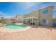 Large backyard with refreshing pool and patio area, perfect for outdoor entertaining at 664 Mystic Cliffs Ave, Las Vegas, NV 89183