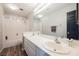 Modern bathroom featuring double sinks, a spacious vanity, and a shower-tub combo for a functional design at 664 Mystic Cliffs Ave, Las Vegas, NV 89183