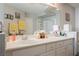 Bathroom with double sink vanity and bright lighting at 664 Mystic Cliffs Ave, Las Vegas, NV 89183
