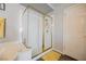 Bright bathroom with a glass-enclosed shower, door, and a yellow rug, providing a clean and functional space at 664 Mystic Cliffs Ave, Las Vegas, NV 89183